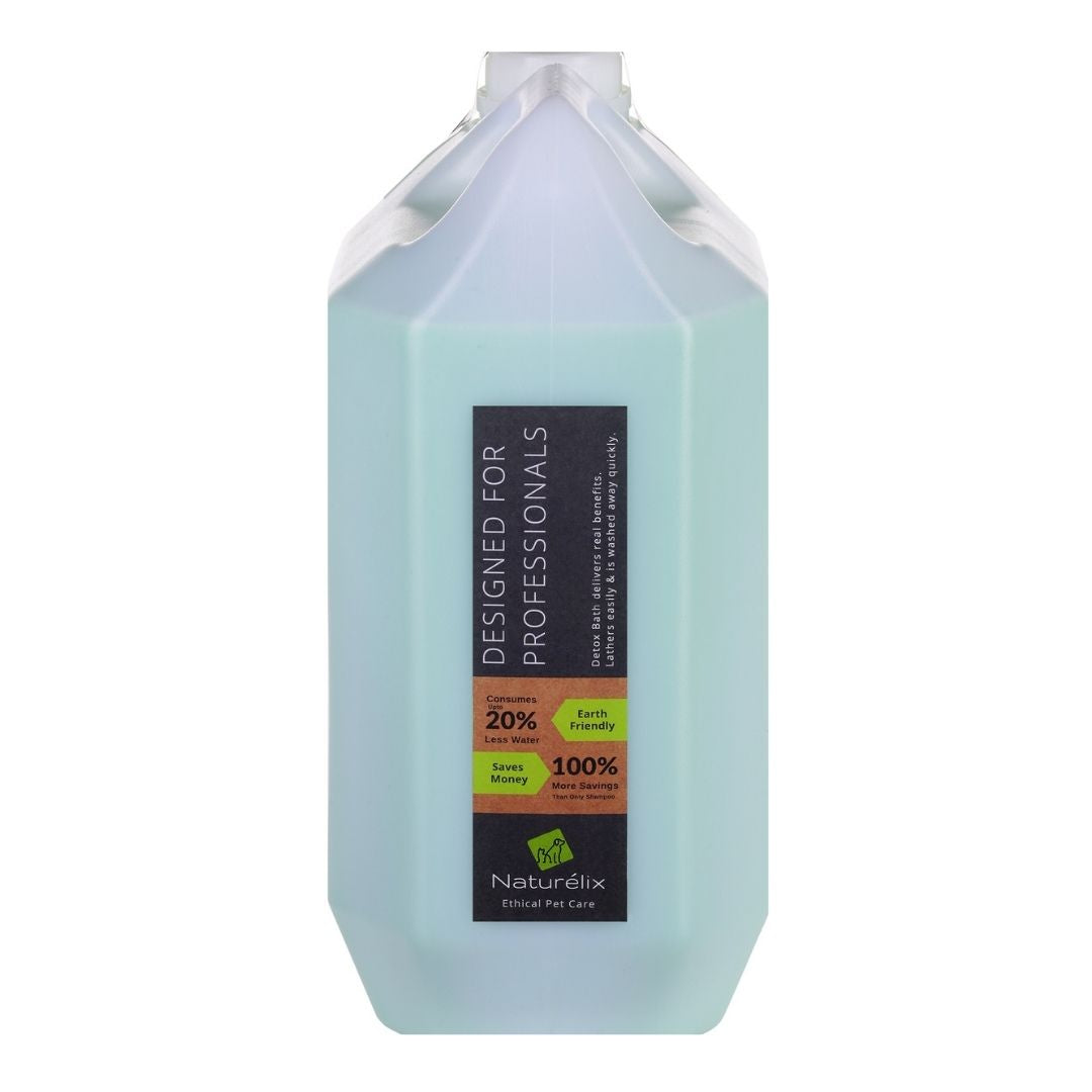 A white 5 liter dog shampoo container side ways showing Eco friendly features.